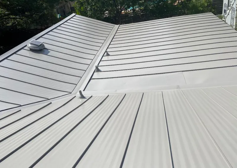 Solar attic fan installed on a metal roof for Roof Ventilation in Red Bluff